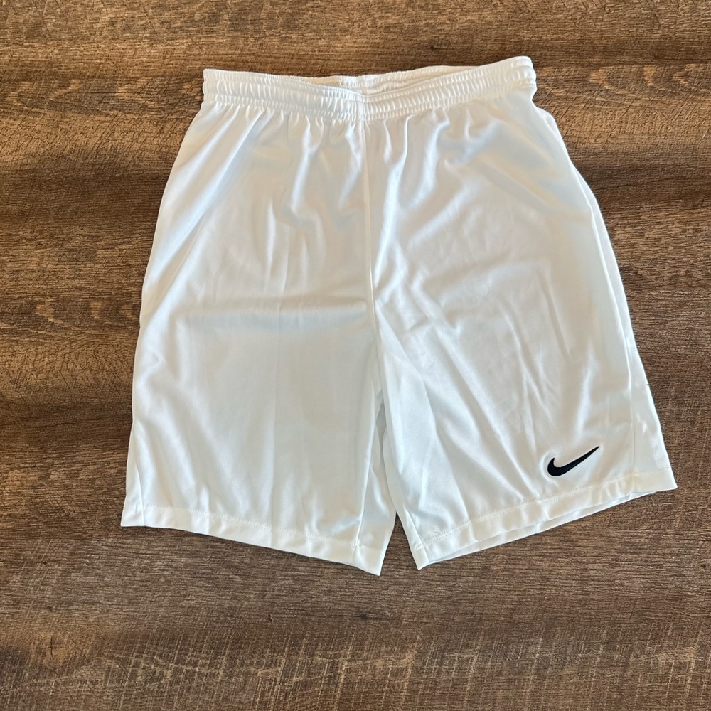 Nike Kids White Athletic Shorts with Black Swoosh